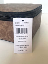 Load image into Gallery viewer, Zipped travel case with a label on a light background