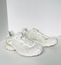 Load image into Gallery viewer, White sneakers on a light gray background