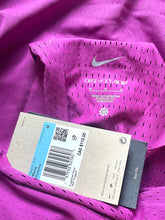 Load image into Gallery viewer, Purple Nike athletic shirt with a tag displaying size and brand information.