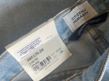 Load image into Gallery viewer, Close-up of denim fabric with a &#39;Citizens of Humanity&#39; label.