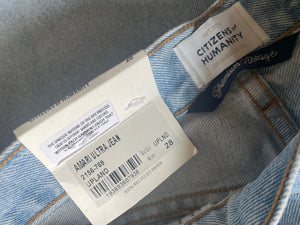 Close-up of denim fabric with a 'Citizens of Humanity' label.