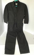 Load image into Gallery viewer, Black coverall on a white surface with a blurred background