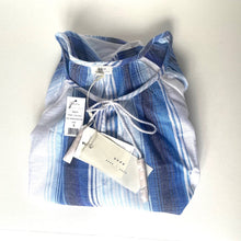 Load image into Gallery viewer, Folded blue and white striped shirt with tags on a white background