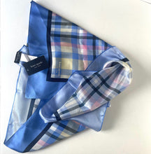 Load image into Gallery viewer, Blue plaid scarf with a visible brand tag on a white background