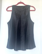 Load image into Gallery viewer, Black sleeveless top on a hanger against a white background
