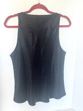 Load image into Gallery viewer, Black sleeveless top on a pink hanger against a white background