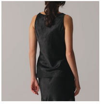 Load image into Gallery viewer, Black sleeveless top worn by a person on a plain background