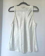 Load image into Gallery viewer, White tank top on a hanger against a white background