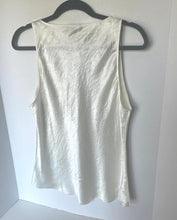 Load image into Gallery viewer, White tank top on a black hanger against a white background