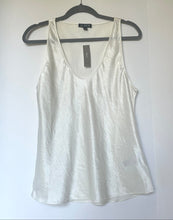 Load image into Gallery viewer, White tank top on a hanger against a white background