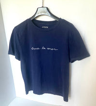 Load image into Gallery viewer, Navy blue t-shirt with white text on a hanger against a white background