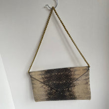 Load image into Gallery viewer, Textured rectangular object with chain on a white background