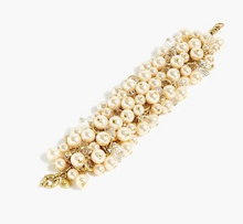 Load image into Gallery viewer, Pearl bracelet with gold accents on a white background