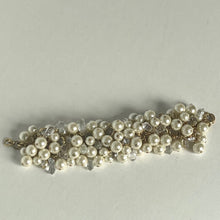 Load image into Gallery viewer, Pearl bracelet with clear crystals on a light gray background