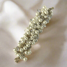 Load image into Gallery viewer, Pearl bracelet with clear crystals on a light gray background