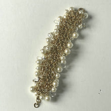 Load image into Gallery viewer, Gold and pearl bracelet on a light gray background