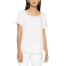 Load image into Gallery viewer, Woman wearing a white blouse with lace details on a white background