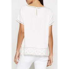 Load image into Gallery viewer, White blouse with lace details on a plain background