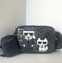 Load image into Gallery viewer, Designer handbag with leopard print and cartoon characters on a white background
