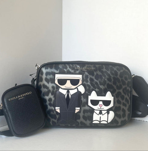Designer handbag with leopard print and cartoon characters on a white background