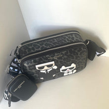 Load image into Gallery viewer, Black patterned bag with Karl Lagerfeld logo on a white background
