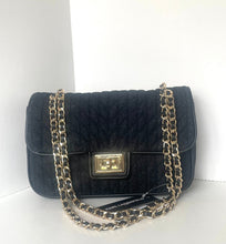 Load image into Gallery viewer, A black quilted leather shoulder bag with a gold-tone chain strap and a central gold-tone clasp, displayed against a white background.