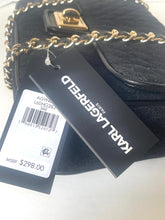 Load image into Gallery viewer, A black quilted Chanel-style handbag with gold-tone chain straps and a gold clasp, shown with two retail tags. One tag reads KARL LAGERFELD, and the other shows a barcode with MSRP $298.
