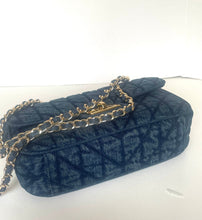 Load image into Gallery viewer, A dark blue quilted monogram handbag with a gold chain strap, displayed on a plain white surface.