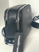 Load image into Gallery viewer, Black leather bag with a visible Karl Lagerfeld tag on a white background