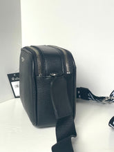 Load image into Gallery viewer, Black leather crossbody bag on a white surface with a white background