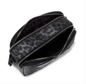 Black handbag with a leopard print strap on a white background