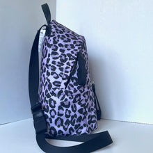 Load image into Gallery viewer, Purple backpack with black leopard print pattern on a white background