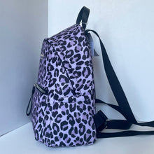 Load image into Gallery viewer, Purple backpack with black leopard print pattern on a white background