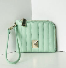 Load image into Gallery viewer, Mint green quilted wallet with a strap on a light gray background