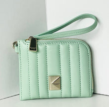 Load image into Gallery viewer, Mint green quilted wallet with a strap on a light gray background
