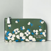 Load image into Gallery viewer, Green wallet with floral pattern and 'kate spade New York' branding on a light gray background