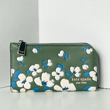 Load image into Gallery viewer, Floral-patterned wallet by Kate Spade on a light gray background