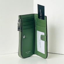 Load image into Gallery viewer, Green wallet with card slots and a visible brand tag on a white background