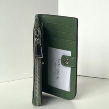 Load image into Gallery viewer, Green wallet with a visible brand label on a white background