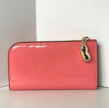 Load image into Gallery viewer, Pink wallet with a gold charm on a white background