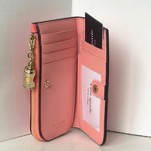 Load image into Gallery viewer, Pink wallet with gold charm on a white background