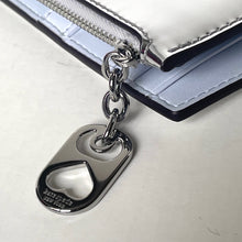 Load image into Gallery viewer, Silver bottle opener keychain attached to a white wallet