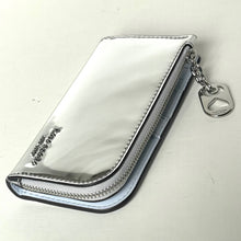 Load image into Gallery viewer, Silver metallic wallet with a chain and heart charm on a white background