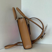 Load image into Gallery viewer, Brown leather handbag with a strap on a white background