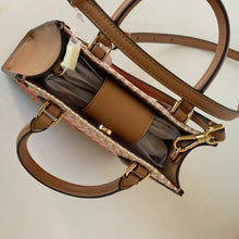 Load image into Gallery viewer, Brown handbag with gold accents on a light beige background