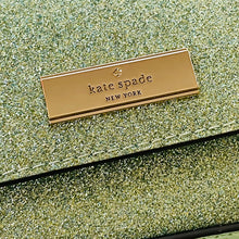 Load image into Gallery viewer, Gold 'kate spade New York' label on a glittery green surface