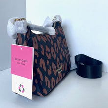 Load image into Gallery viewer, Kate Spade handbag with a pattern and a visible tag on a white background