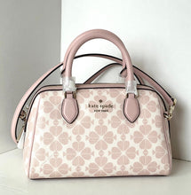 Load image into Gallery viewer, Pink and white patterned handbag with 'kate spade new york' logo on a light background