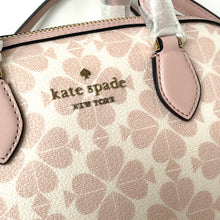 Load image into Gallery viewer, Close-up of a Kate Spade handbag with a pink and white pattern.