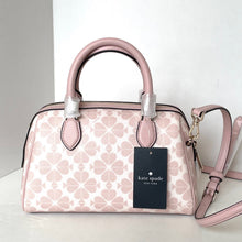 Load image into Gallery viewer, Pink handbag with floral pattern and Kate Spade tag on a white background